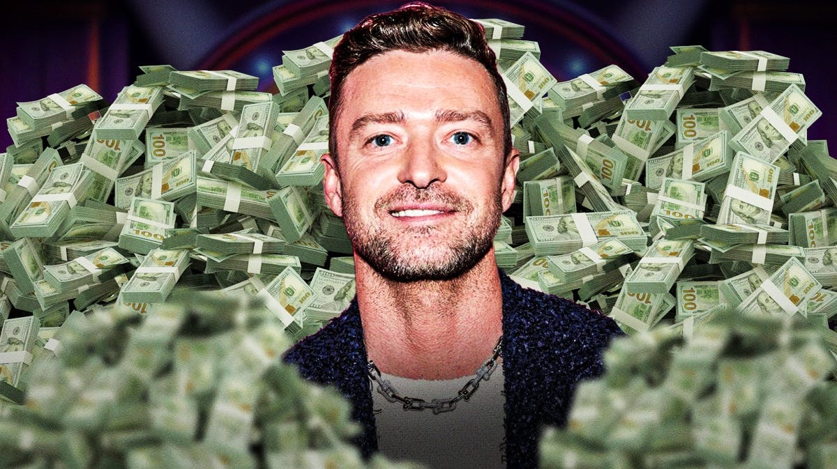 Justin Timberlake surrounded by piles of cash.