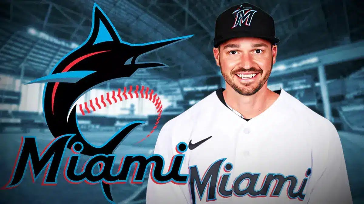Trey Mancini wearing a Marlins jersey next to a Marlins logo in front of loanDepot Park.