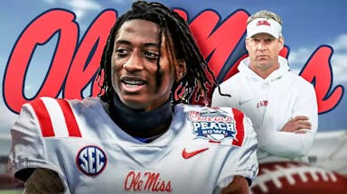 Photo: Amorion Walker in Ole Miss uniform with Lane Kiffin and Ole Miss logo behind them