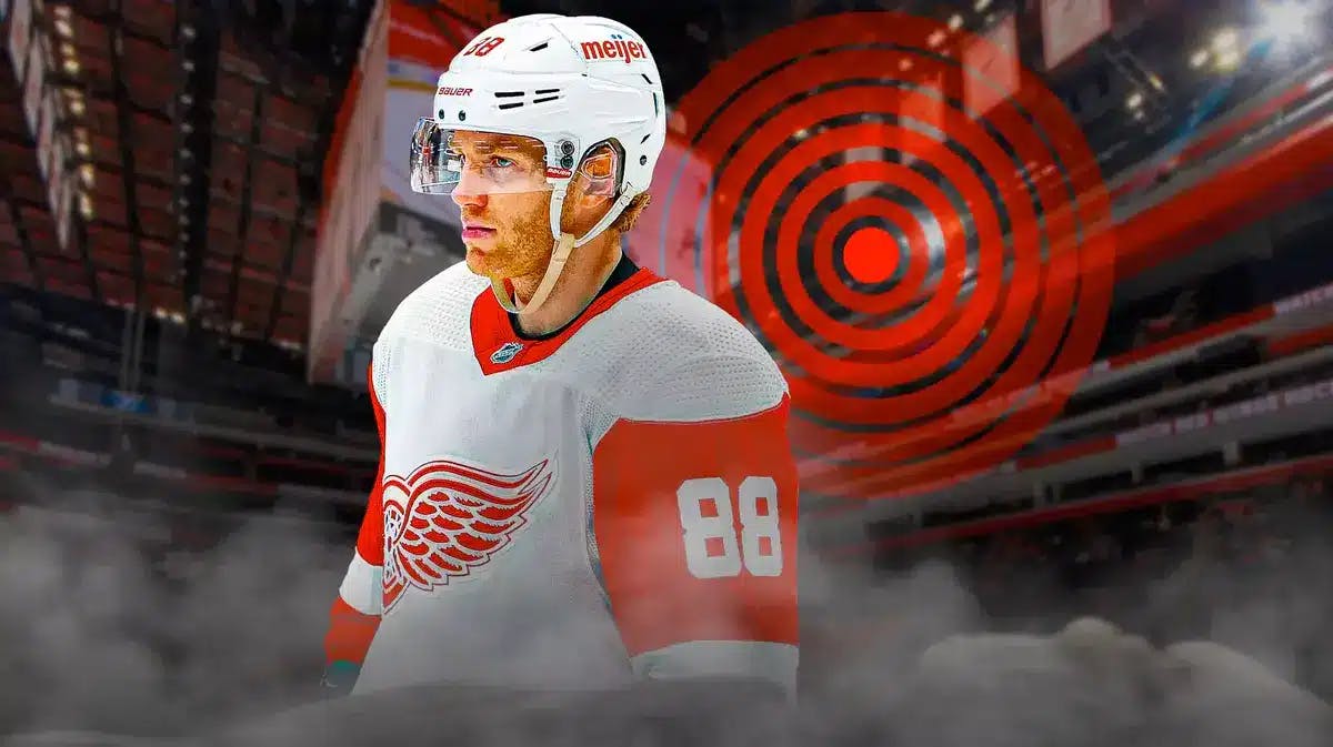 Action shot of Patrick Kane (Red Wings) with red aching symbol behind him