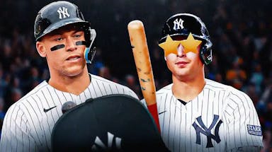 Aaron Judge on one side, Anthony Volpe on the other side with stars in his eyes