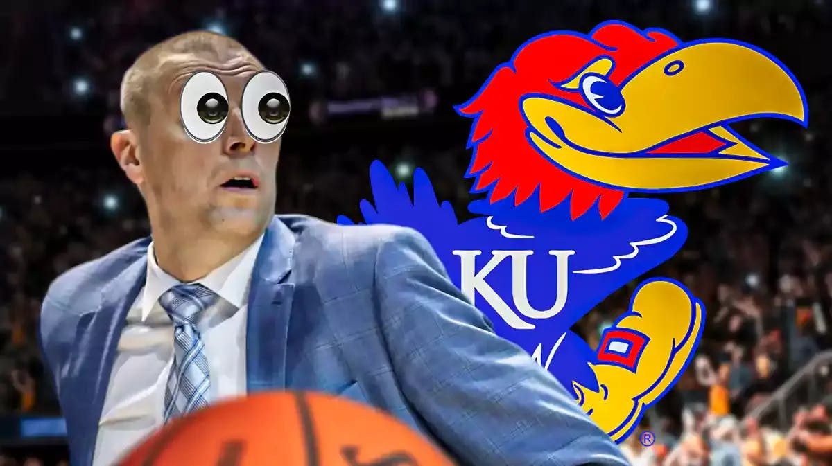 BYU basketball’s Mark Pope with eyes popping out looking at the Kansas basketball logo.