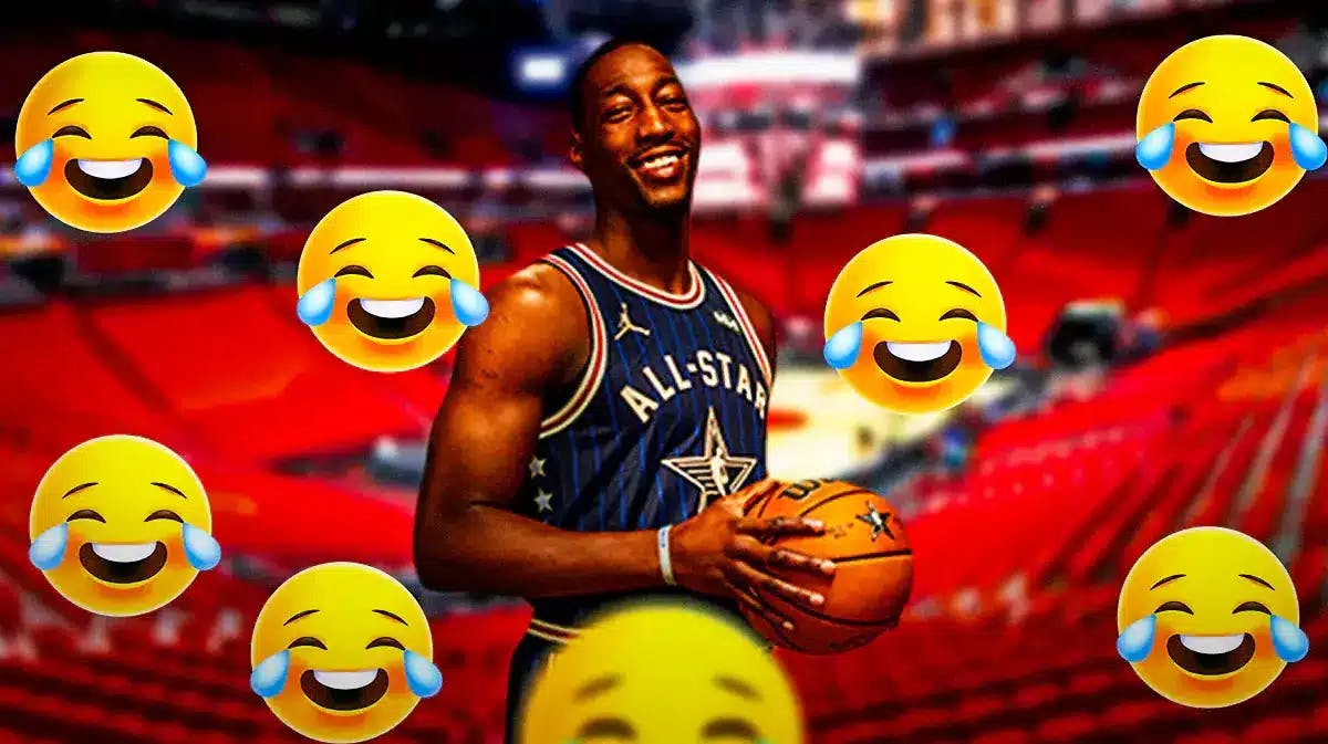 Miami Heat star Bam Adebayo with laughing emojis around him in front of the Kaseya Center.