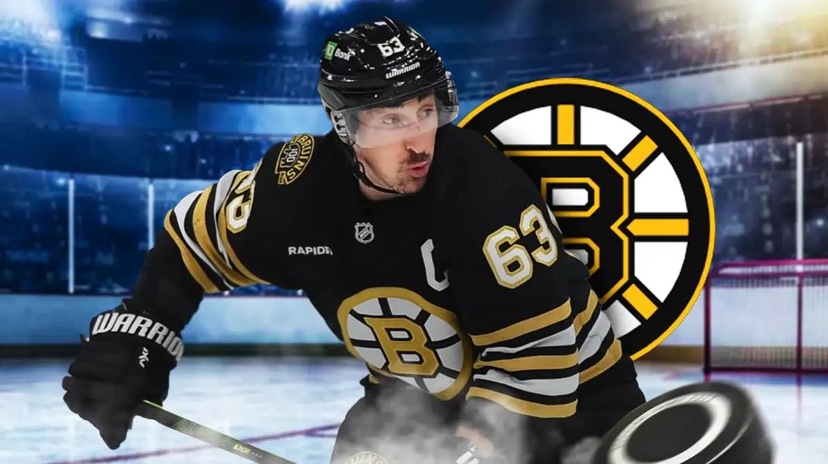 Brad Marchand stands in front of Bruins logo before his record-breaking Lightning game