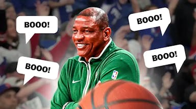 Photo: Doc Rivers smiling coaching Bucks, booing 76ers fans in background