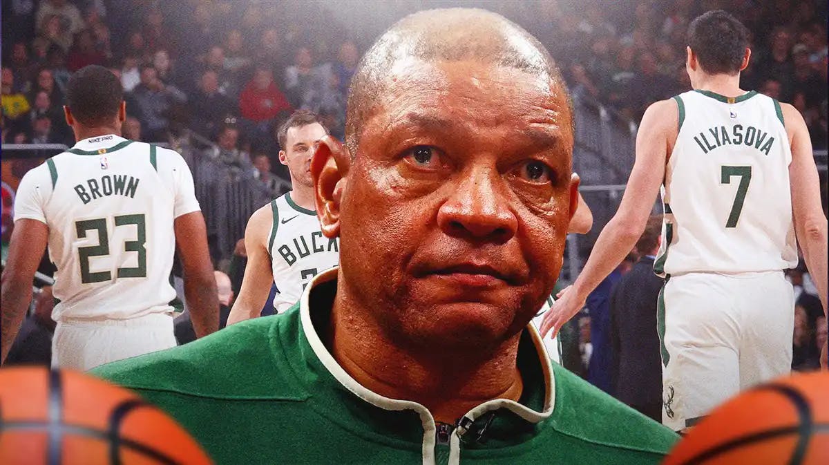 Bucks head coach Doc Rivers looking distraught with players in the background.