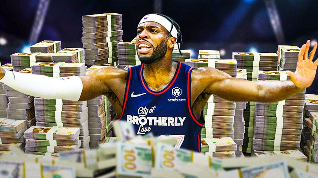 Buddy Hield surrounded by piles of cash.