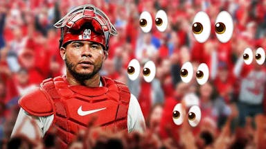 Willson Contreras on one side, a bunch of St. Louis Cardinals fans on the other side with the big eyes emoji over their faces