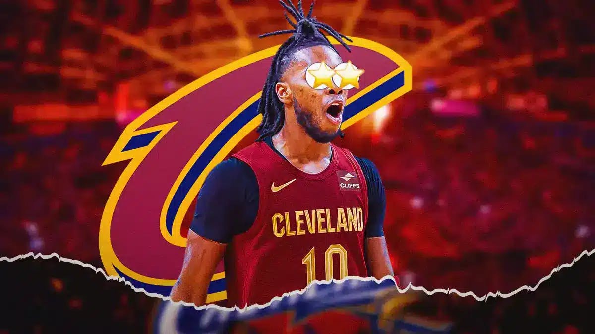 Darius Garland with stars in his eyes in front of a Cavs logo