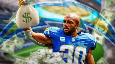 Chargers Austin Ekeler holding a bag of money