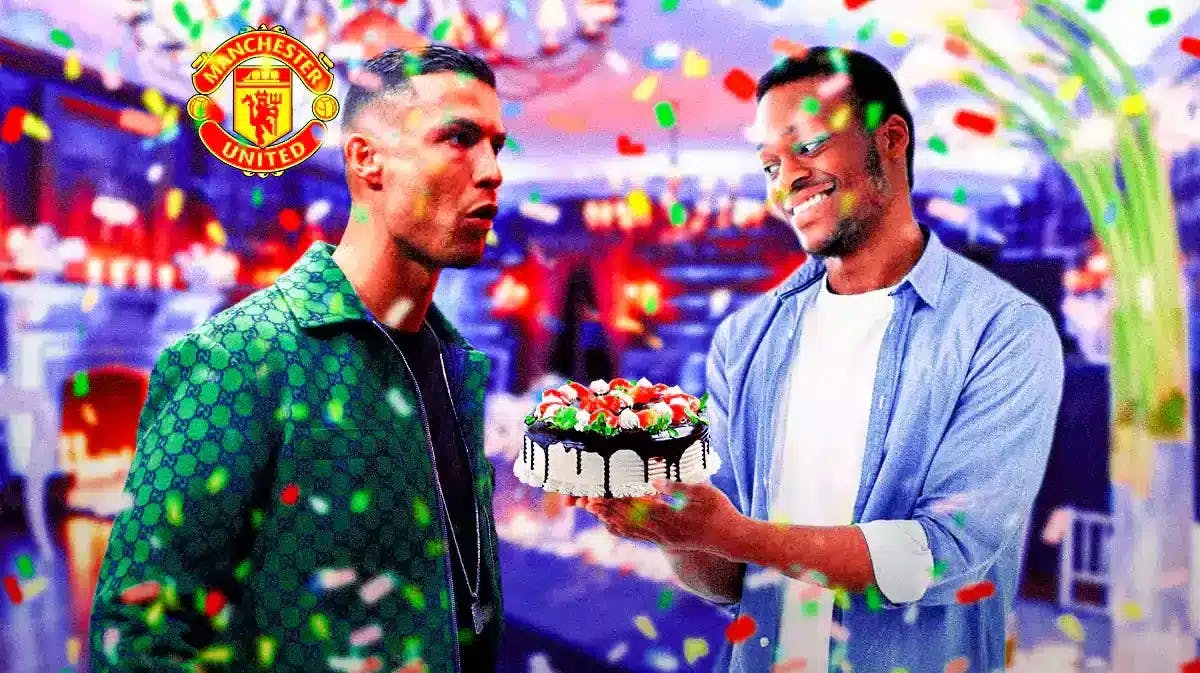 Cristiano Ronaldo in a birthday party and a guy next to him giving him a birthday cake with the Manchester United logo over his head