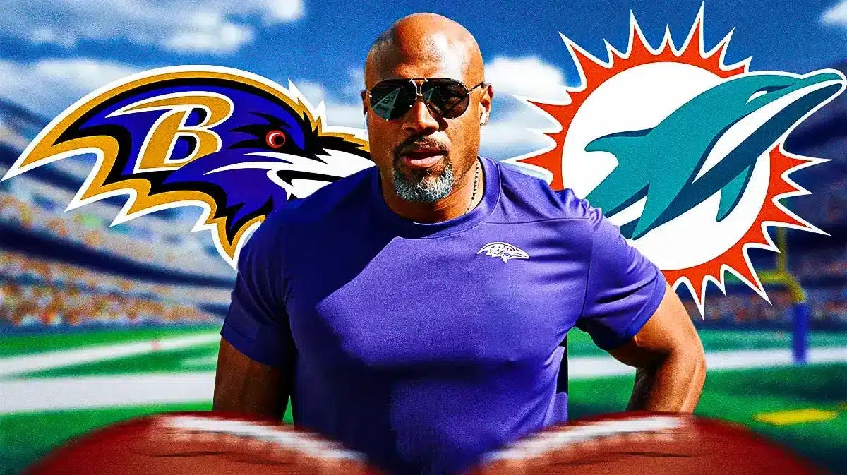 Miami Dolphins new defensive coordinator Anthony Weaver in the middle of the Dolphins and Baltimore Ravens logos in front of Hard Rock Stadium.
