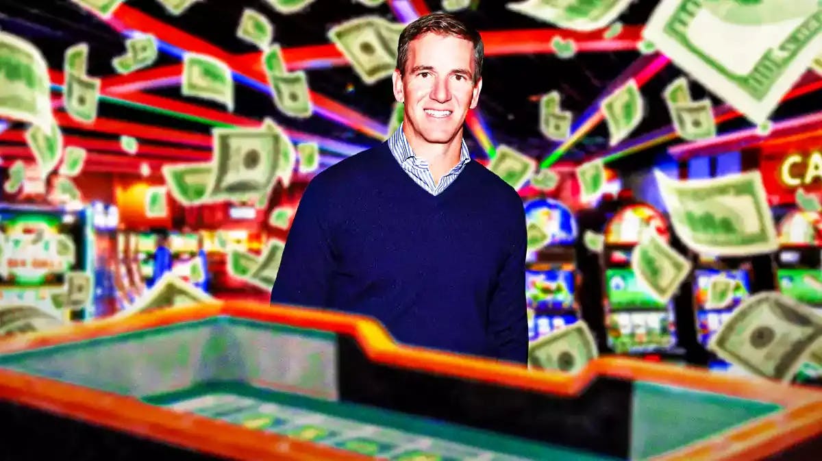 Former Giants quarterback Eli Manning (current day) smiling next to a craps table with money falling all around