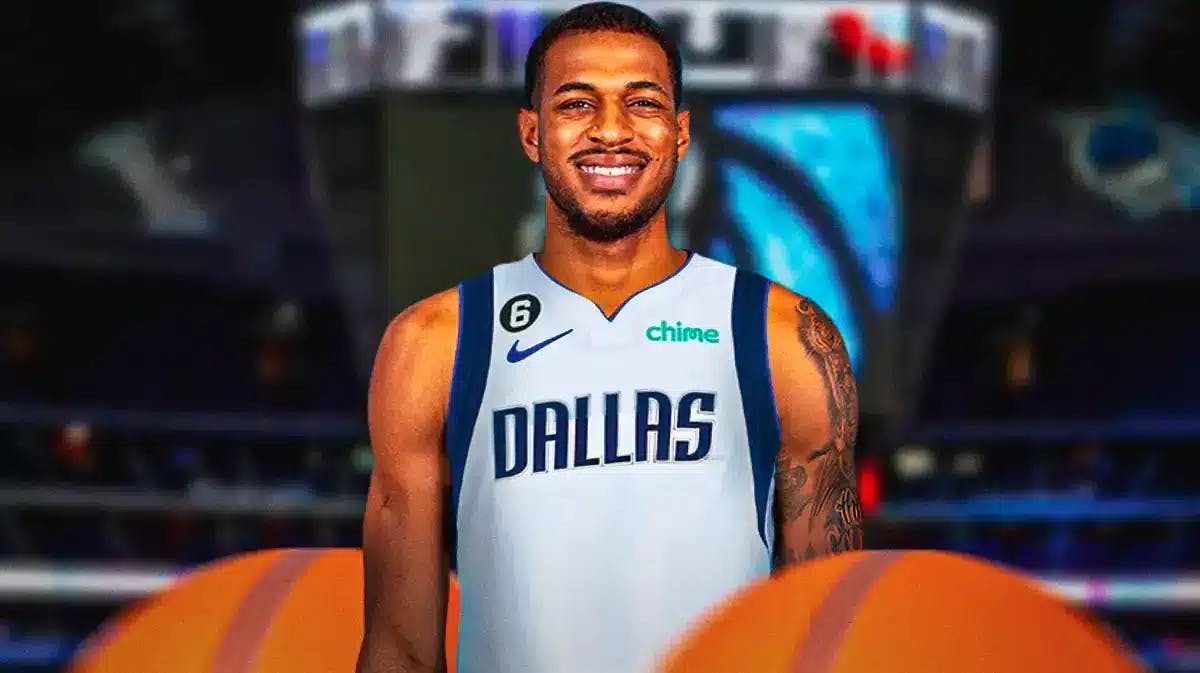 Daniel Gafford in a Mavericks uniform with the American Airlines Center in background.