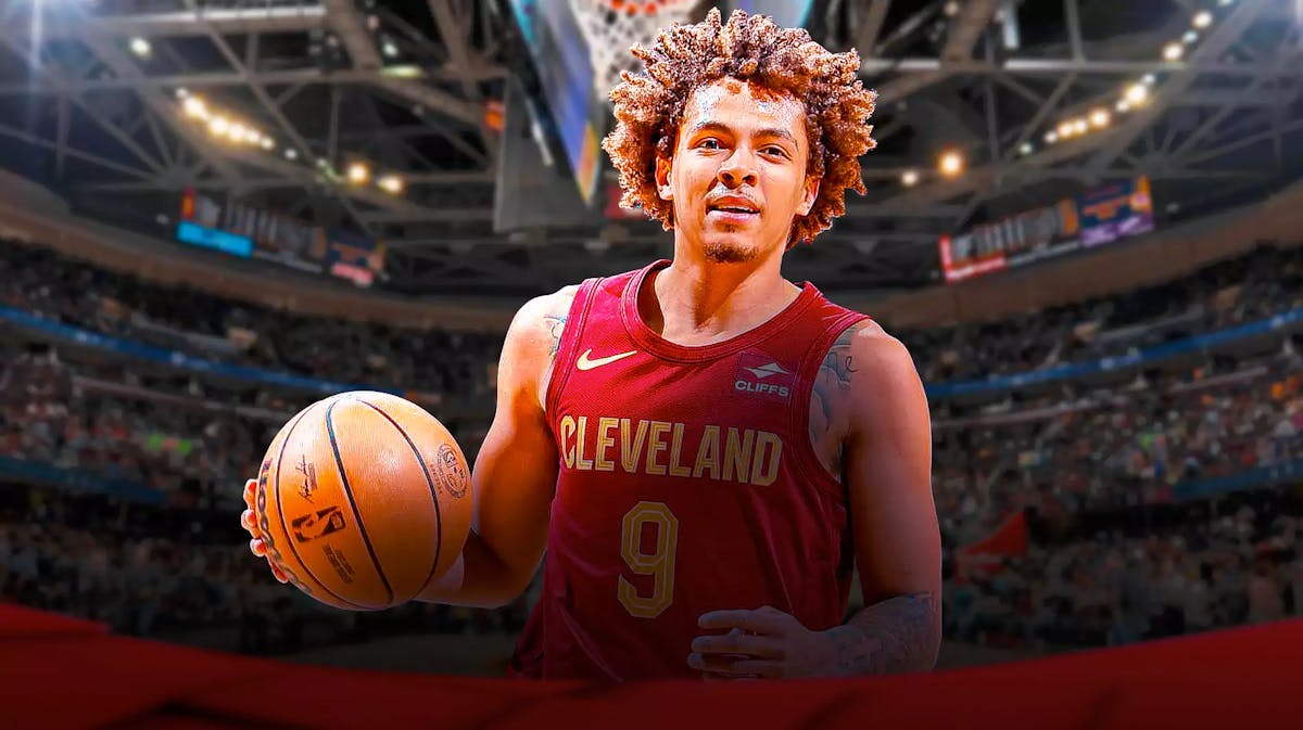 Craig Porter Jr. in his Cavs jersey with the Cavs arena in the background, contract