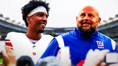 Giants coach Brian Daboll smiling looking at LSU QB Jayden Daniels in a Giants jersey after going to NY in latest Daniel Jeremiah mock draft.