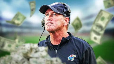 Kansas football coach Lance Leipold with money swirling around.