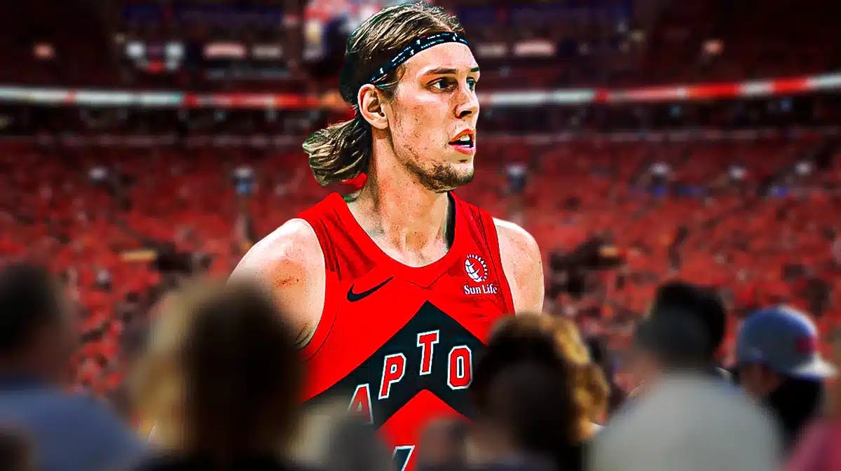 Kelly Olynyk in a Raptors jersey with the Raptors arena in the background