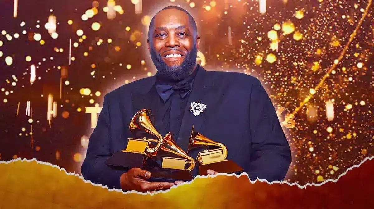 Killer Mike holding 3 Grammy trophies.