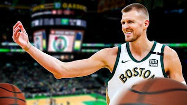 Celtics' Kristaps Porzingis smiling on a TD Garden background
