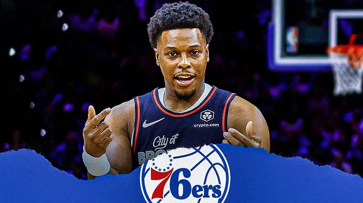 Kyle Lowry in his Sixers jersey with Sixers fans in the background