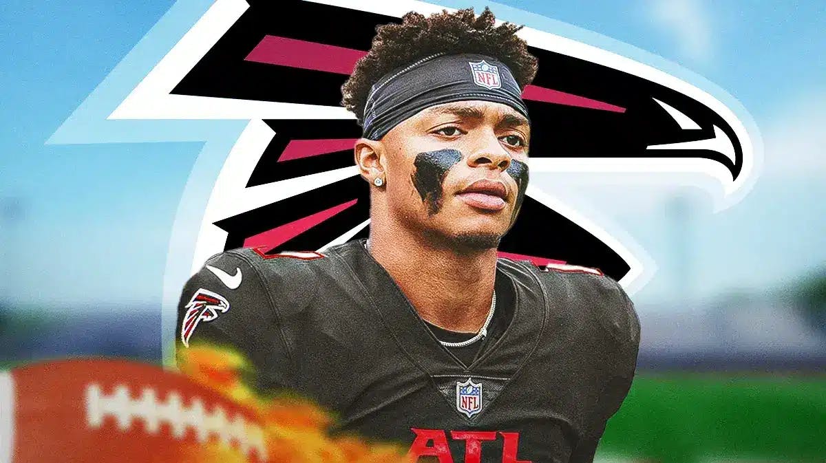 Photo: Justin Fields in Falcons gear with Falcons logo behind him