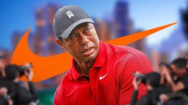Tiger Woods golfs in Nike apparel