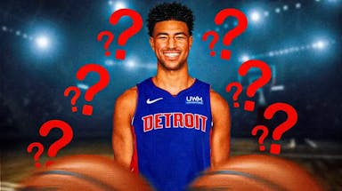 Quentin Grimes in a Detroit Pistons jersey with a bunch of question marks in the background