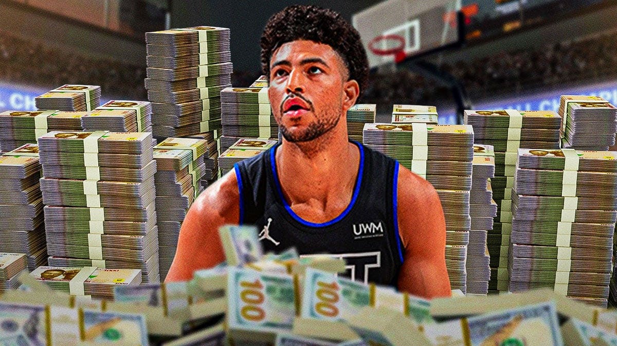 Quentin Grimes surrounded by piles of cash.