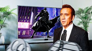 Nicolas Cage next to a TV with Spider-Man Noir on it