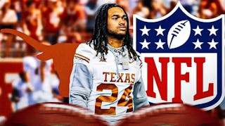 Jonathan Brooks stands on Texas football field next to 2024 NFL Draft logo after his injury