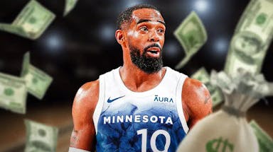 Timberwolves guard Mike Conley Jr., money flying around in background