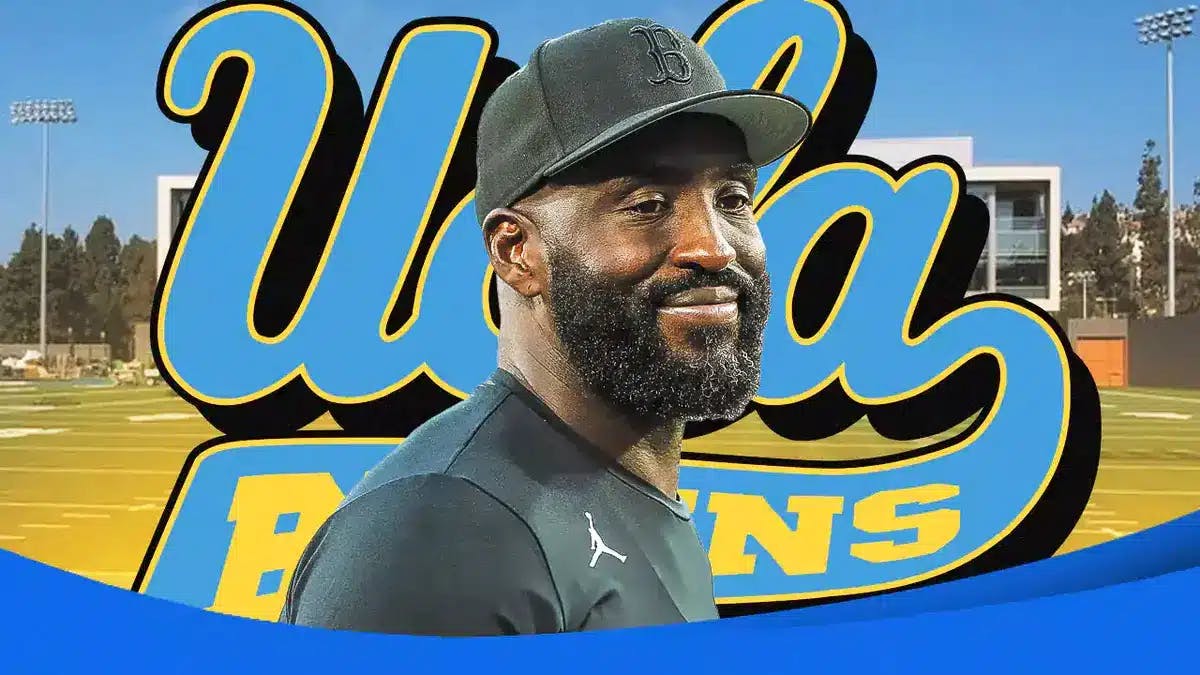 DeShaun Foster stands in front of UCLA Bruins football logo after Chip Kelly's Ohio State move