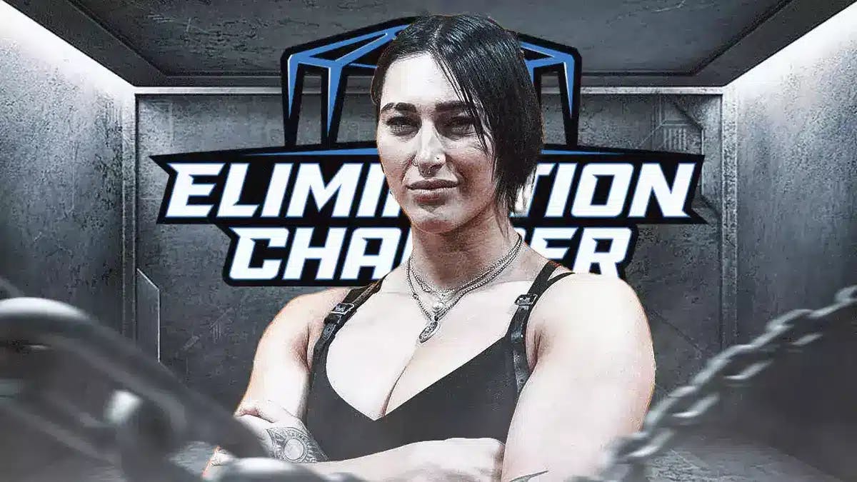 Rhea Ripley in front of the Elimination Chamber graphic.