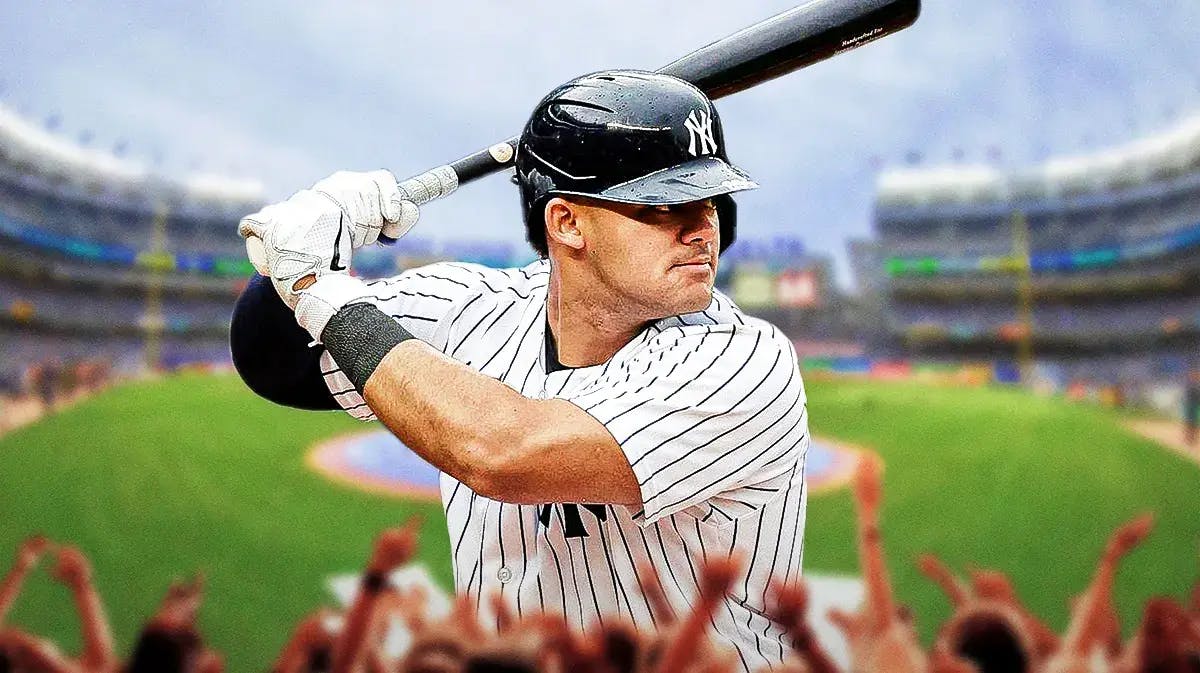 Yankees' Jasson Dominguez swinging a baseball bat at Yankee Stadium.