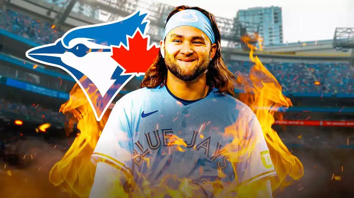Toronto Blue Jays' Bo Bichette stands in front of AL East fans ahead of Spring Training