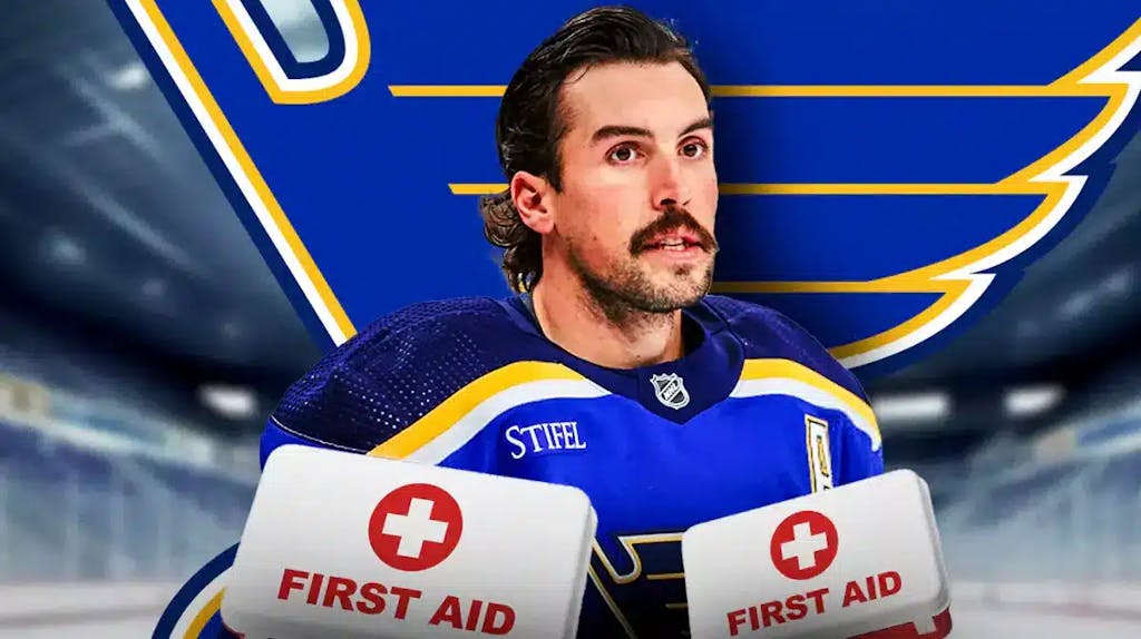 Justin Faulk in middle looking stern, St. Louis Blues logo, first aid kit, hockey rink in background