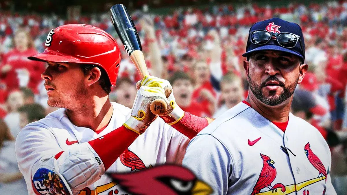 Nolan Gorman hitting next to Oliver Marmol, both in St. Louis Cardinals jerseys
