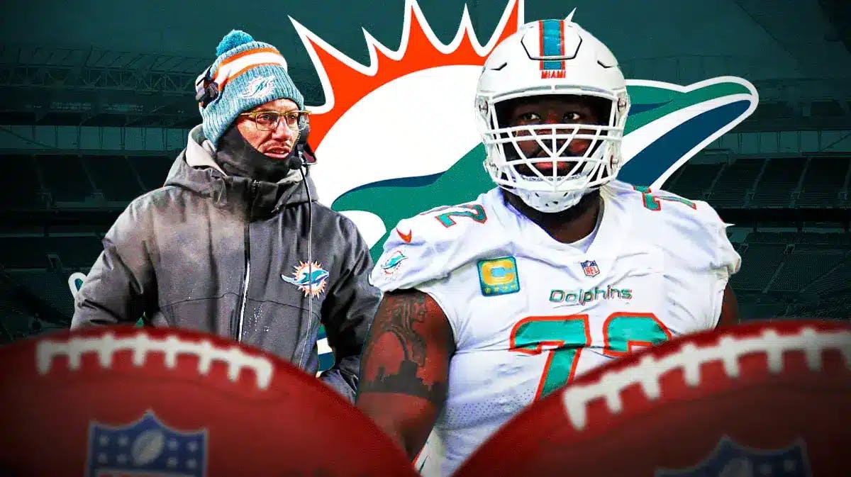 Mike McDaniel and Terron Armstead in front of a Dolphins logo
