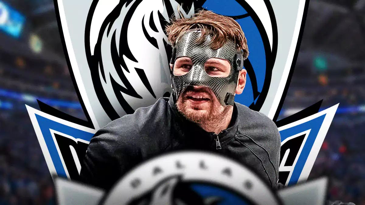 Mavericks guard Luka Doncic with a black face mask on.