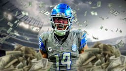 Lions WR Amon-Ra St. Brown with a lot of money around him.
