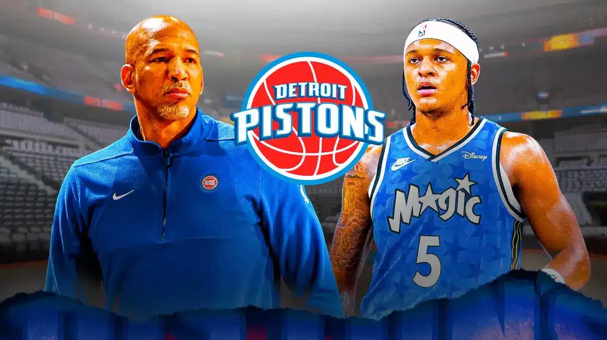 Pistons' Monty Williams stands next to Magic forward Paolo Banchero