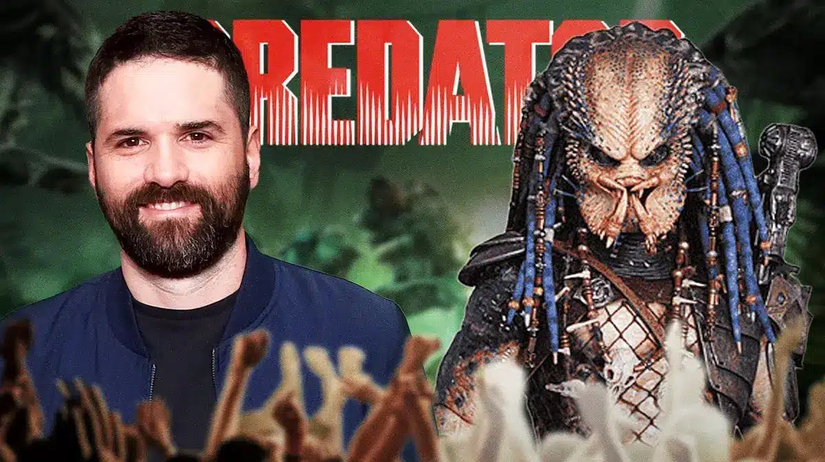 Dan Trachtenberg next to a Predator and the Predator series logo in the background
