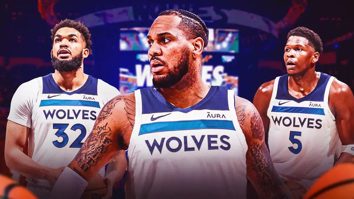 Monte Morris in Timberwolves uniform next to Anthony Edwards and Rudy Gobert