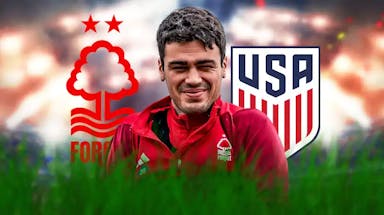 Gio Reyna smiling in front of the Nottingham Forest and USMNT logos
