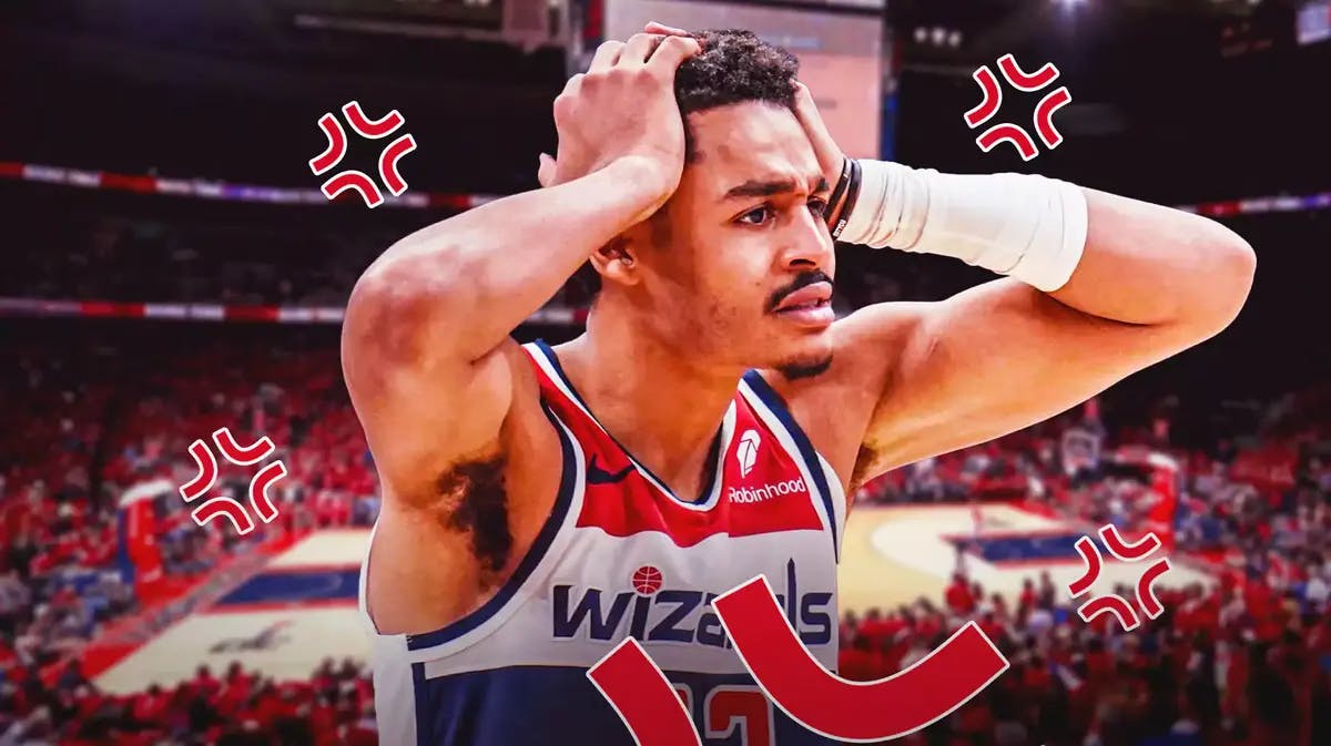Jordan Poole (Wizards) lookling shocked with angry vein emojis in the backgound