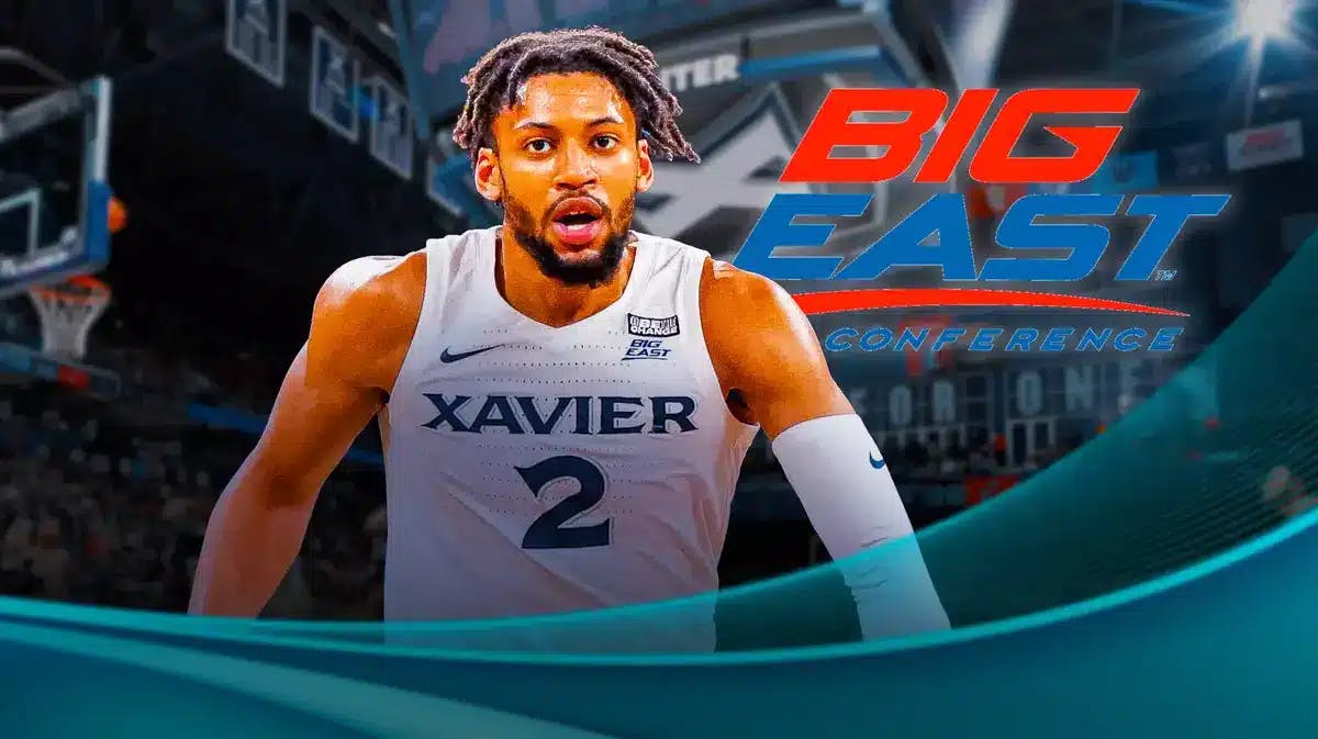 Xavier Musketeers basketball forward Jerome Hunter stands next to Big East logo amid news of his injury