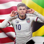 Christian Pulisic celebrating in front of the USA and Jamaica flags