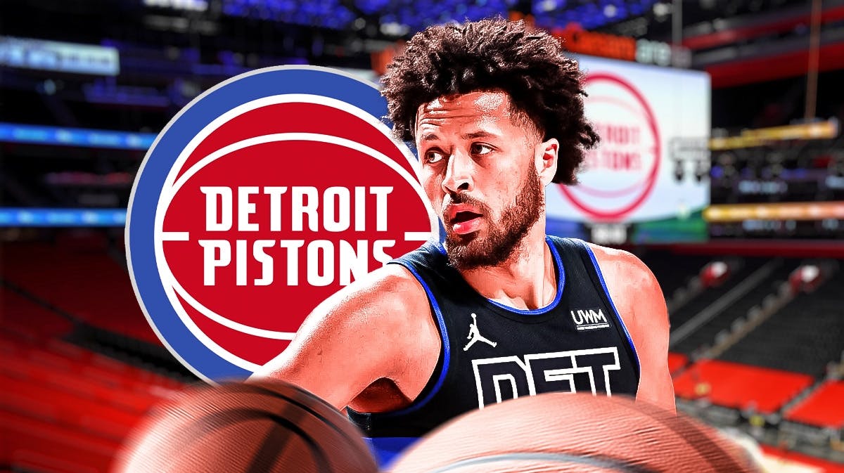 Cade Cunningham next to a Pistons logo at Little Caesars Arena