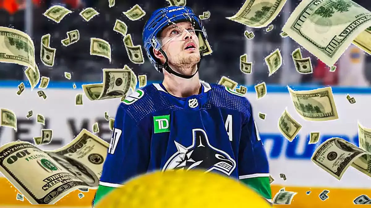 Elias Pettersson with money falling all around Vancouver Canucks